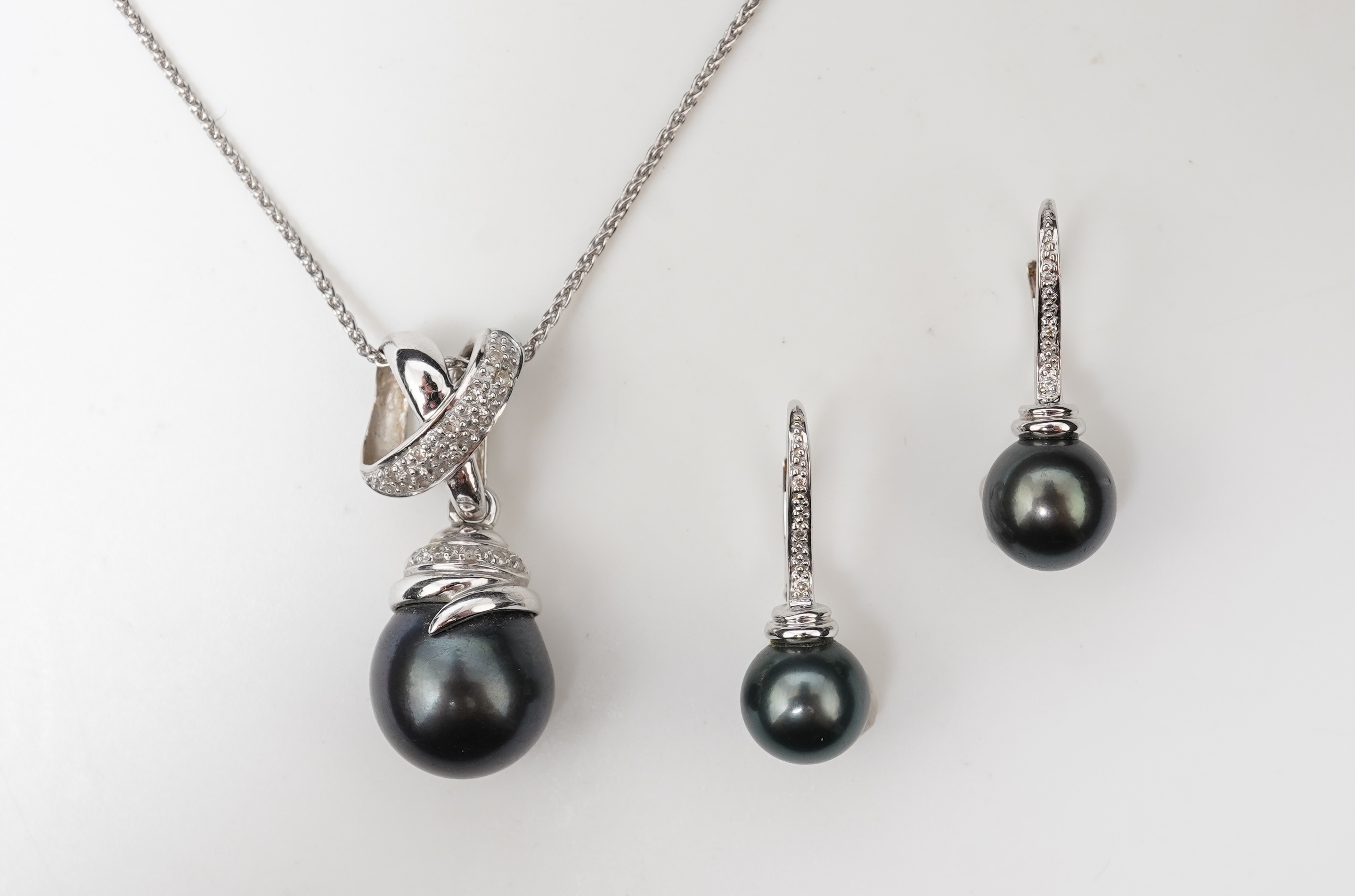 A cultured pearl and diamond demi-parure